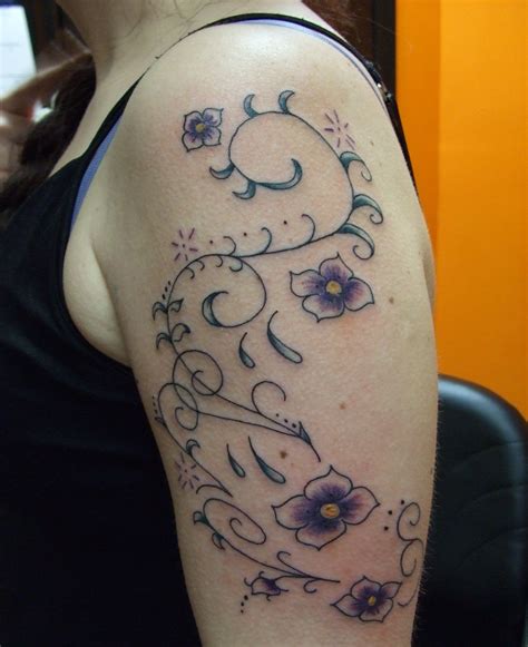 flowers on a vine tattoo